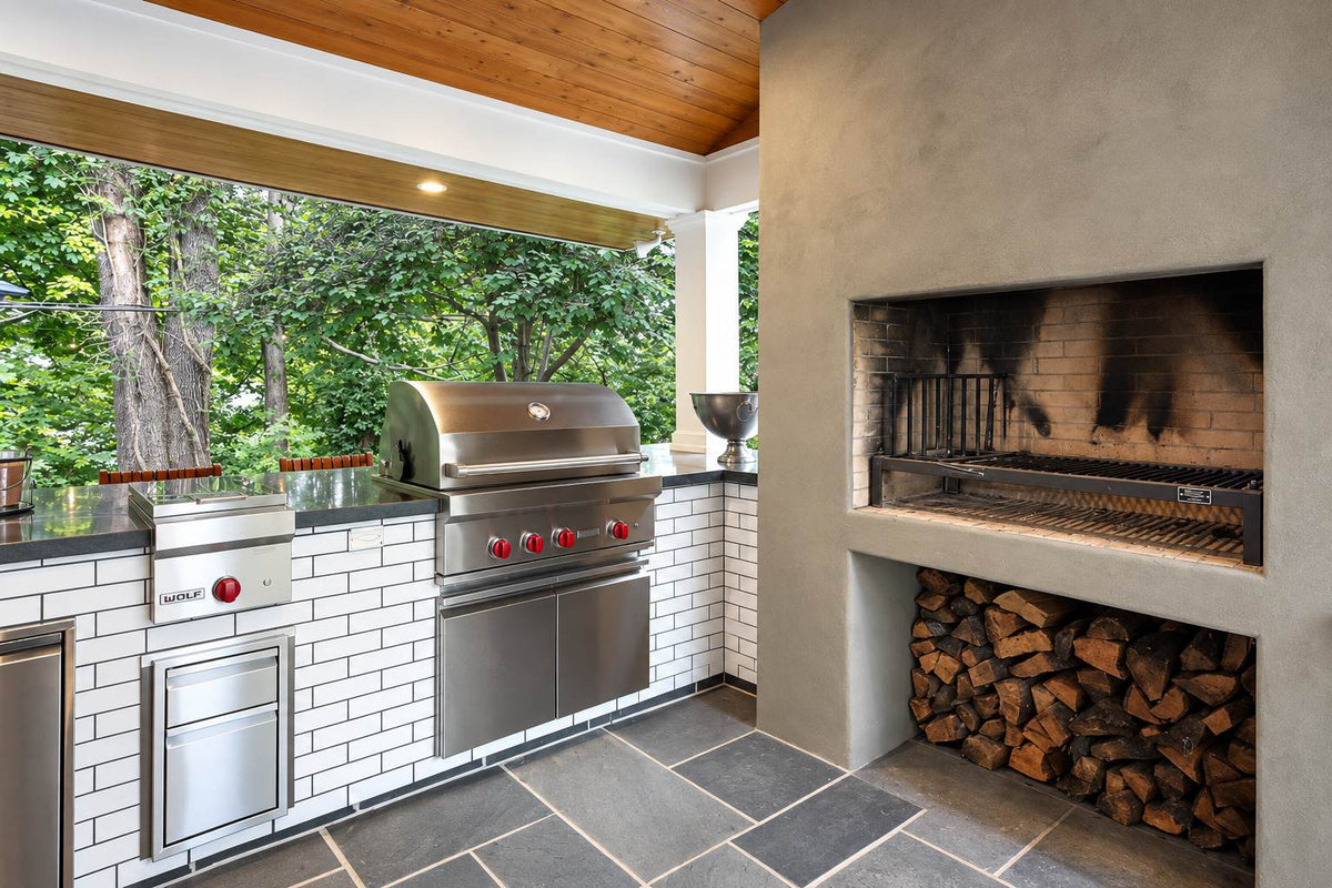Model 241302 Uruguayan grill kit installed in a customer’s masonry fireplace and outdoor kitchen