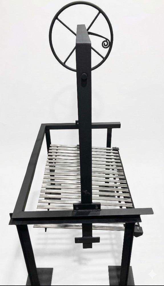 Side view of Model #4546 Argentine grill kit with 3-sided flange, black steel frame, stainless V-grate, and adjustable wheel height control for masonry firebox installation.