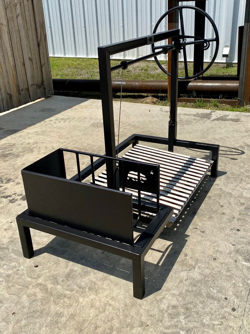 Side view of Heritage Backyard free-standing stilt grill kit with side brasero and adjustable-height grate