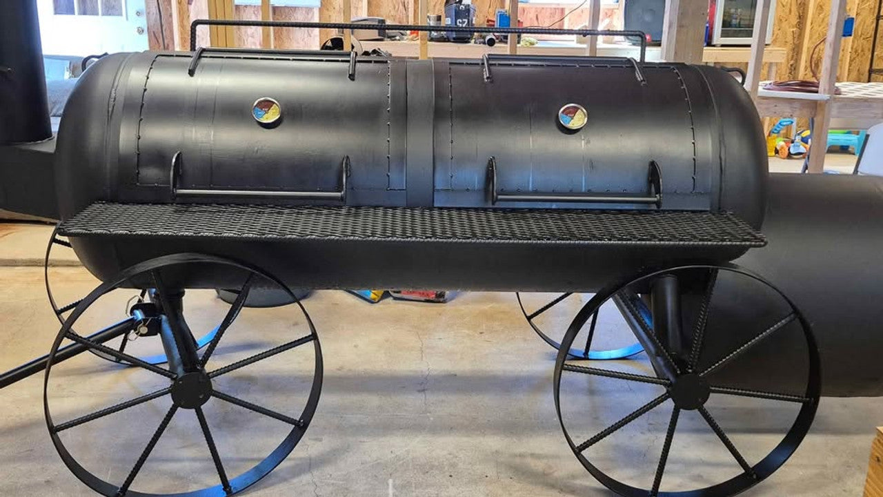 Heavy-duty 250 Gallon offset BBQ pit with wagon steering and smoke stack