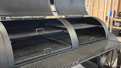 Texas-style offset smoker with dual lids and 4 pullout cooking trays open inside view