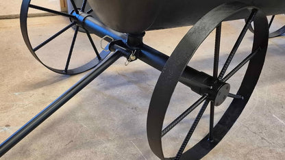 Wagon wheels on the 250 Gallon wood fired Offset smoker.