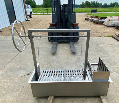 All Stainless Steel Argentine Outdoor Kitchen Grill with Side Wheel and Brasero, handcrafted in the USA, shown with polished grilling surface and bundled Stainless Steel Tool Set.