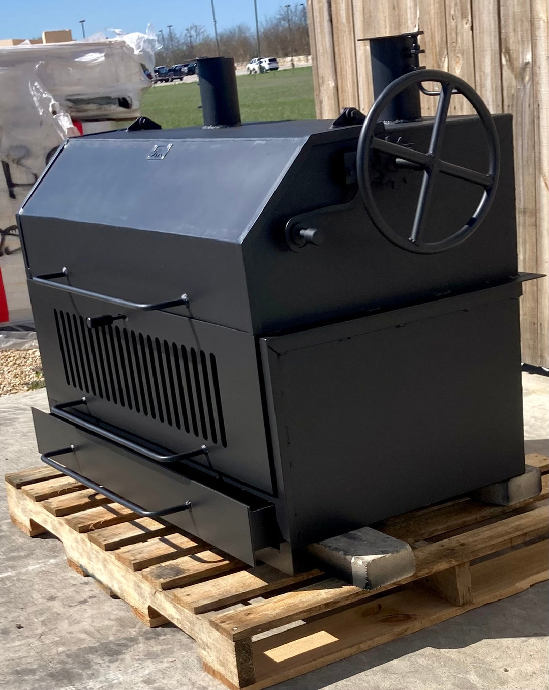 Built-In Bear Flag Grill with Firebox a Lid and Smokestacks