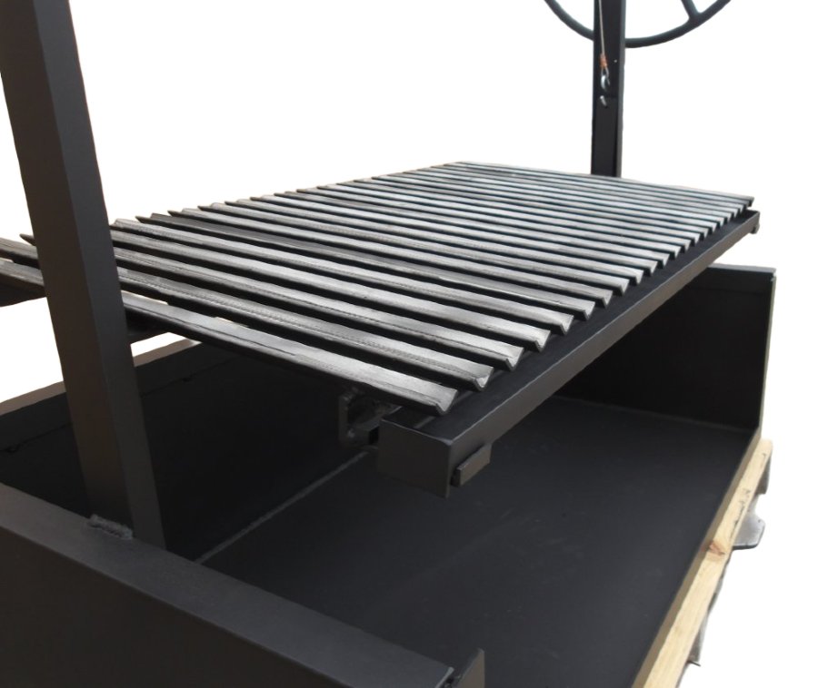 An Argentine built-in grill featuring a steel firebox, a V-grate with a drip pan, and a side wheel to adjust the height of the grill grate. 