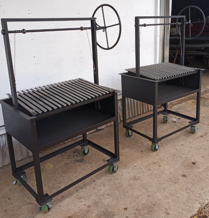 Argentine BBQ Grill with an open firebox and stainless V-grate for cooking with wood or charcoal.