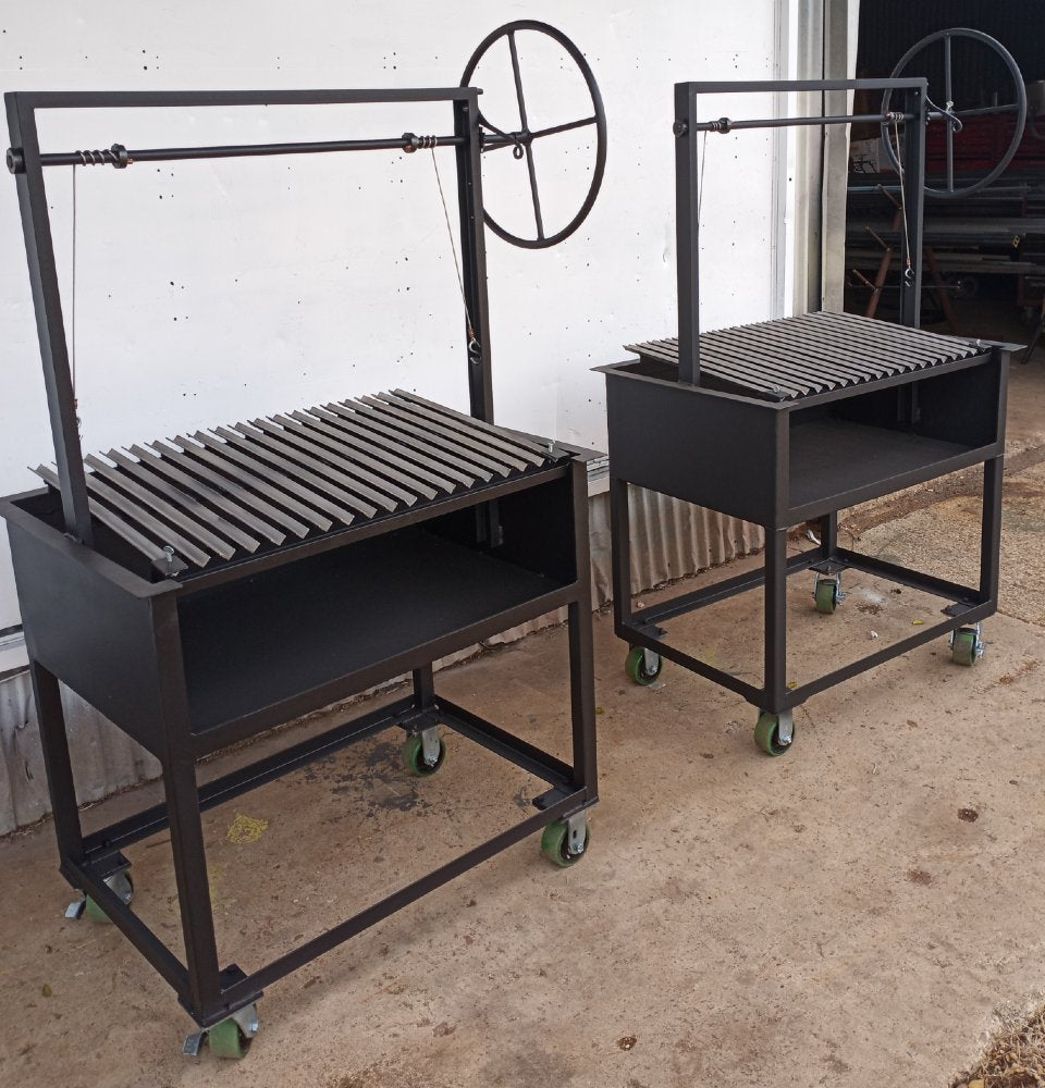 Argentine BBQ Grill with an open firebox and stainless V-grate for cooking with wood or charcoal.