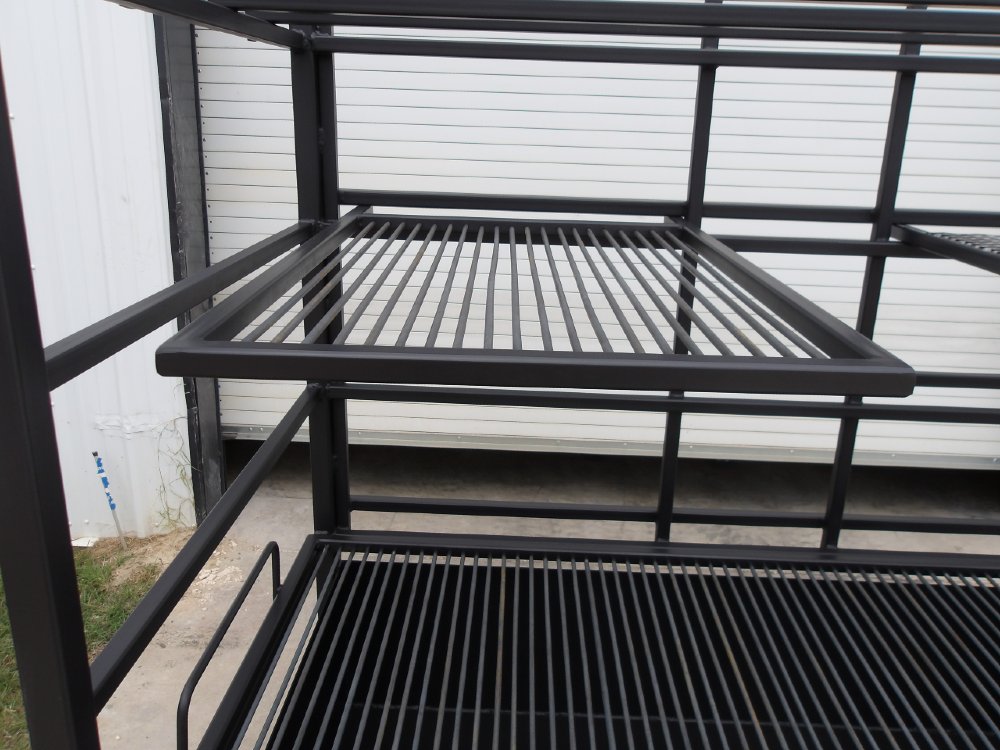 Close-up of upper adjustable steel grate on Portico Open-Fire BBQ Grill #4947 for multi-level cooking.