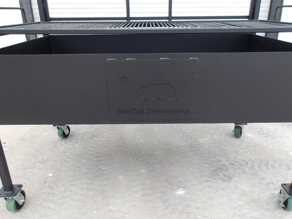 Firebox detail of Portico BBQ Grill #4947 featuring embossed NorCal Ovenworks bear logo on steel panel.
