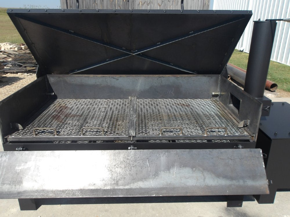 Large-capacity offset smoker with insulated firebox and smokestack for even heat and authentic wood-fired flavor, inside view