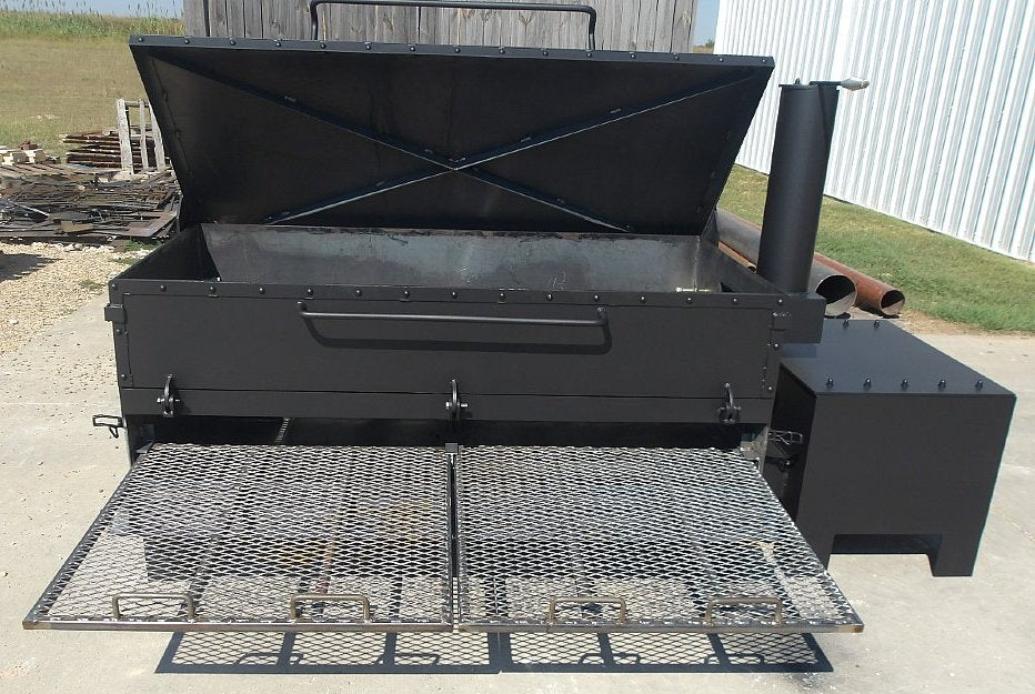 Pull-out smoker grates extended for easy loading and unloading of food on a commercial offset wood smoker