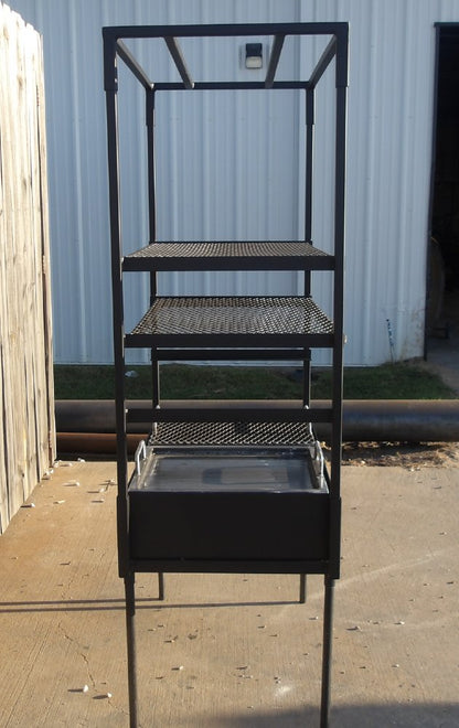 Side angle of 4956 Advanced Armado showing adjustable cooking racks and solid steel firebox