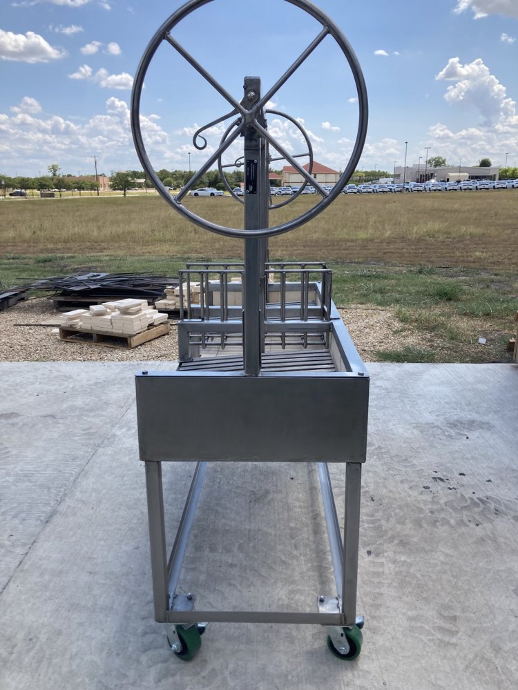 Portable Argentine Grill Model #4480 featuring Split V-Grates, Rear Firebox, Center Brasero, and casters for mobility — includes free matching Argentine Tool Set. 