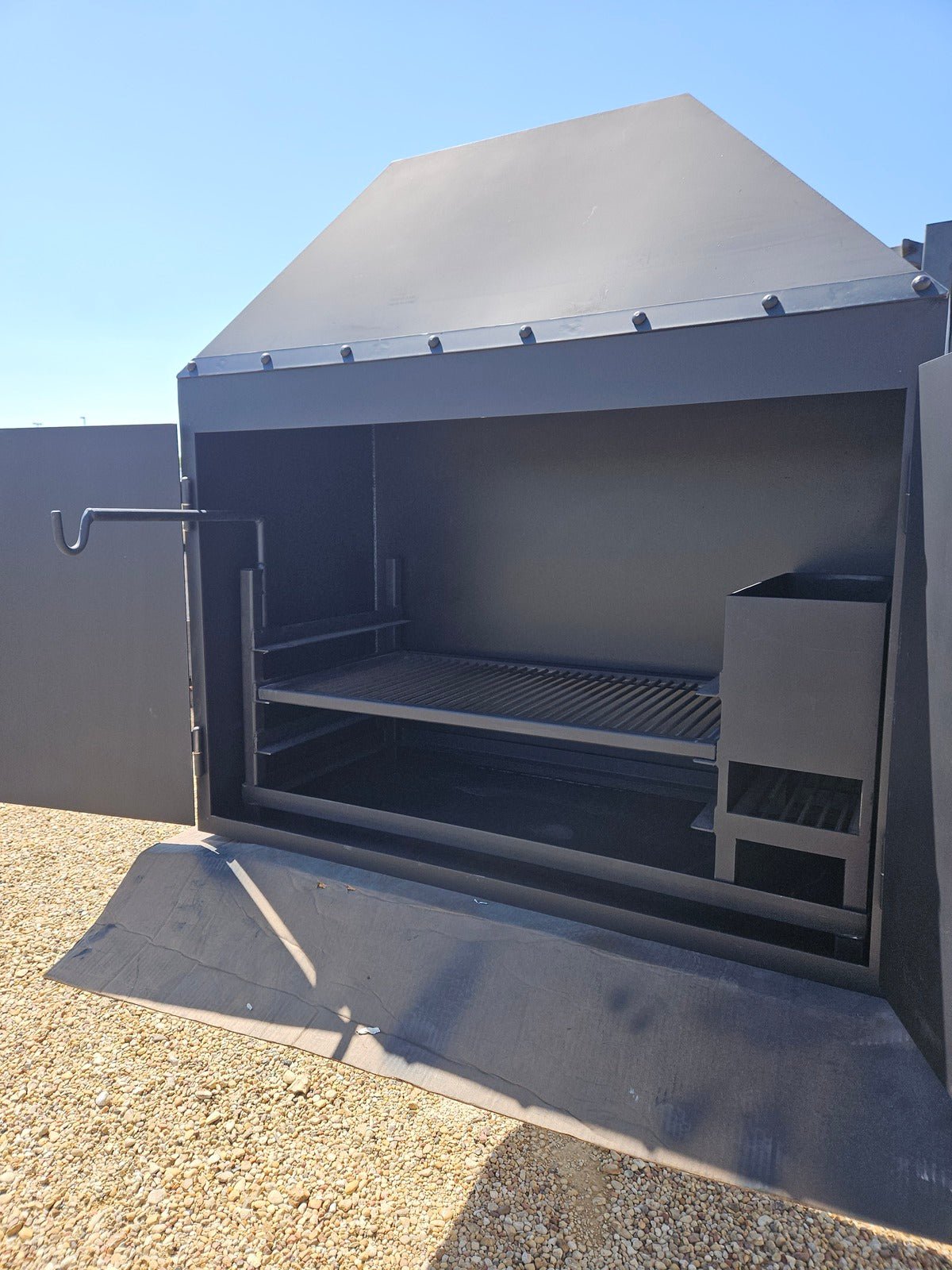 Fireplace With Doors and a BBQ Grill Insert - Heritage Backyard Inc.