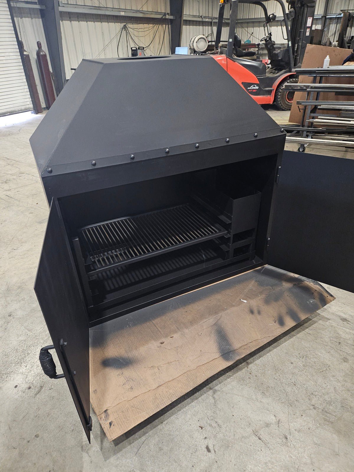 Fireplace With Doors and a BBQ Grill Insert - Heritage Backyard Inc.
