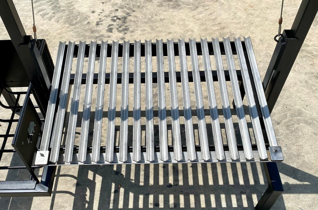 Close-up of Argentine V-grate cooking surface on Heritage Backyard Model 1066 stilt grill kit
