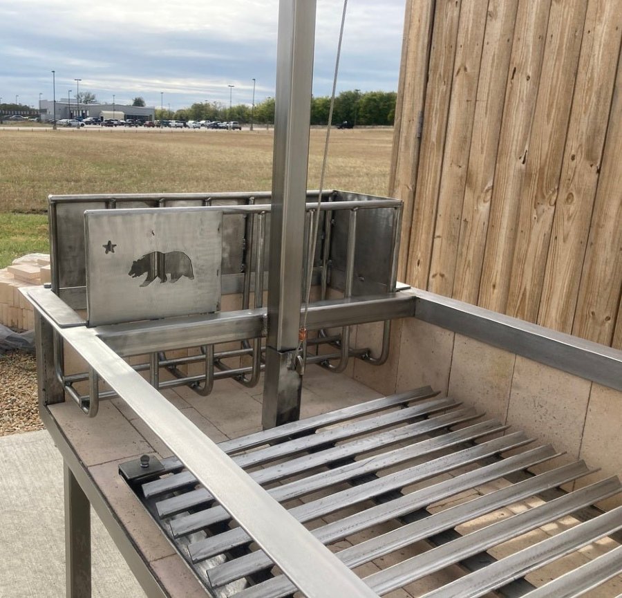 Stainless Steel Portable Wood Fire and Charcoal  Argentine Grill with Ember Making Side Brasero, V-Grate with Drip Pan, and Adjustable Height Grill Grate
