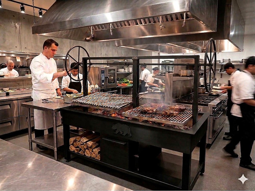 Commercial charcoal grill with adjustable grates cooking over wood fire in a professional restaurant kitchen