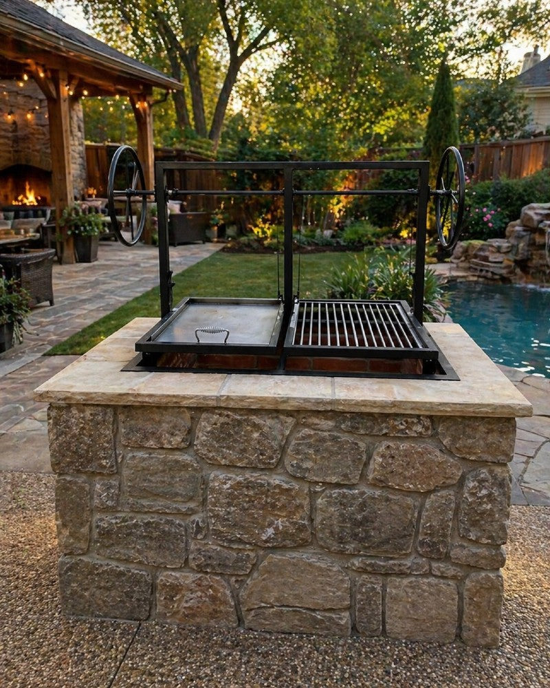 Built-in split Santa Maria grill with plancha and round rod grate installed in a stone outdoor kitchen for wood or charcoal cooking